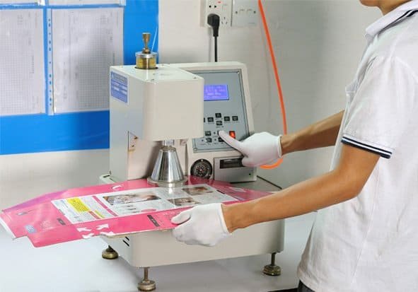 Burst Strength Tester measuring paperboard resistance and material strength for cartons