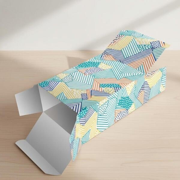 Reverse Tuck End folding carton with top and bottom flaps folding in opposite directions