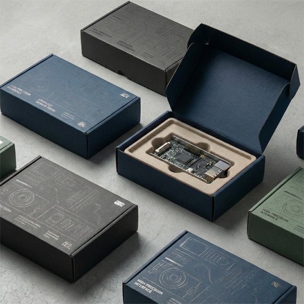 Electronics corrugated packaging with paper insert and multi-color printed box design to reduce transit damage.