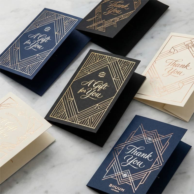 Luxury gift card holders with premium foil stamping for a high-end, metallic finish.