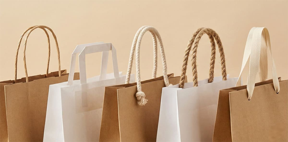 Eco-friendly handle options for paper bags including twisted paper cord, flat paper handle, cotton rope, jute rope, and cotton ribbon